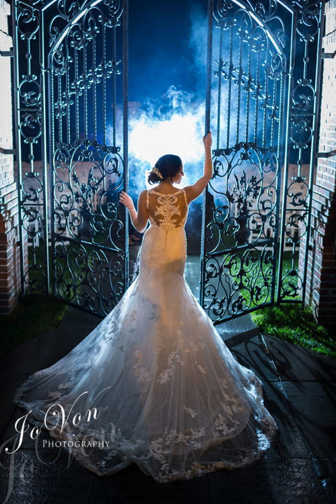 Bride in front of our garden gates
