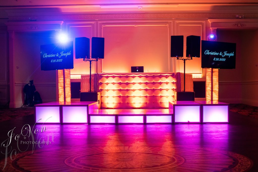 A DJ booth set up for an event inside the Inn at New Hyde Park, the best catering hall in Long Island with exceptional DJ services